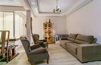 Imagem 3: Apartamento de 113m2, living em 3 ambientes cercado por jardim de inverno