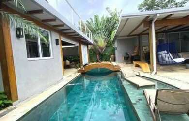 Imagem: A casa possui 5 Dormitórios, 5 Banheiros, 2 Vagas na garagem