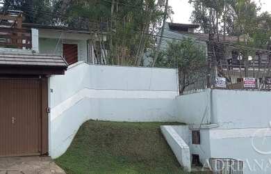 Imagem: A casa possui 3 Dormitórios, 3 Banheiros, 3 Vagas na garagem