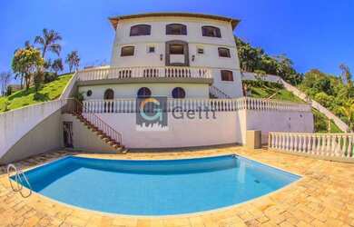 Imagem: A casa possui 4 Dormitórios, 5 Banheiros, 5 Vagas na garagem