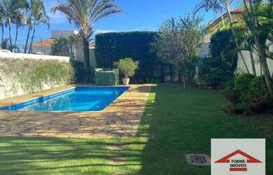 Imagem: A casa possui 5 Dormitórios, 5 Banheiros, 5 Vagas na garagem