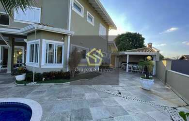 Imagem: A casa possui 4 Dormitórios, 5 Banheiros, 5 Vagas na garagem