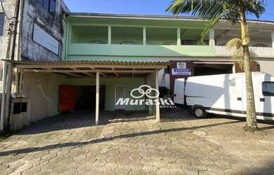 Imagem: A casa possui 4 Dormitórios, 4 Banheiros, 4 Vagas na garagem