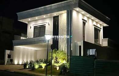 Imagem: A casa possui 4 Dormitórios, 5 Banheiros, 4 Vagas na garagem