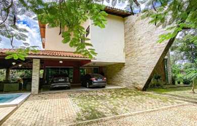 Imagem: A casa possui 4 Dormitórios, 5 Banheiros, 5 Vagas na garagem