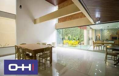 Imagem: A casa possui 3 Dormitórios, 5 Banheiros, 4 Vagas na garagem