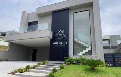 Imagem: A casa possui 4 Dormitórios, 5 Banheiros, 4 Vagas na garagem