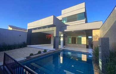 Imagem: A casa possui 4 Dormitórios, 5 Banheiros, 4 Vagas na garagem