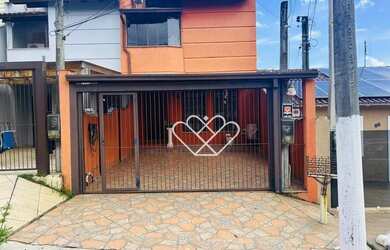 Imagem: A casa possui 3 Dormitórios, 3 Banheiros, 2 Vagas na garagem