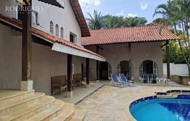 Imagem: A casa possui 5 Dormitórios, 5 Banheiros, 5 Vagas na garagem