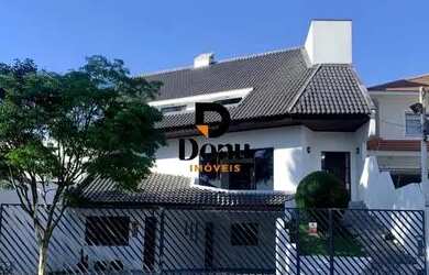 Imagem: A casa possui 4 Dormitórios, 5 Banheiros, 5 Vagas na garagem