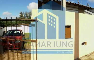 Imagem: A casa possui 2 Dormitórios, 1 Banheiro, 2 Vagas na garagem