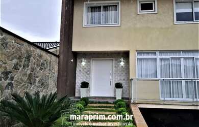 Imagem: A casa possui 3 Dormitórios, 4 Banheiros, 3 Vagas na garagem