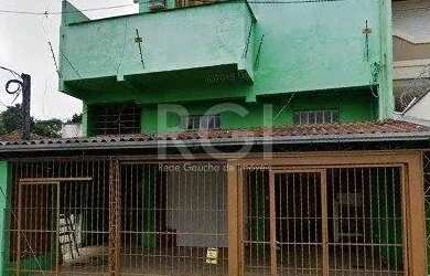 Imagem: A casa possui 3 Dormitórios, 2 Banheiros, 1 Vaga na garagem