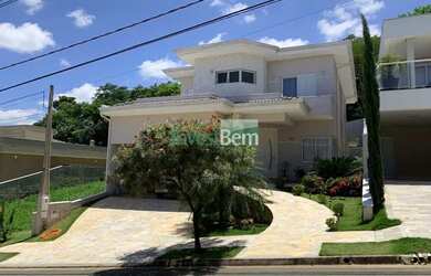 Imagem: A casa possui 3 Dormitórios, 4 Banheiros, 4 Vagas na garagem