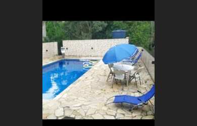 Imagem: A casa possui 3 Dormitórios, 4 Vagas na garagem e está localizado