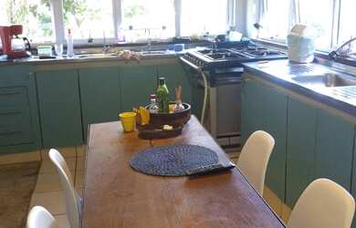 Imagem: A casa possui 5 Dormitórios, 5 Banheiros, 4 Vagas na garagem