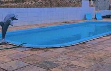 Imagem: A casa possui 2 Dormitórios, 2 Vagas na garagem e está localizado