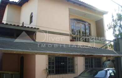 Imagem: A casa possui 5 Dormitórios, 3 Banheiros, 3 Vagas na garagem