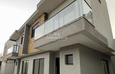 Imagem: A casa possui 3 Dormitórios, 3 Banheiros, 2 Vagas na garagem