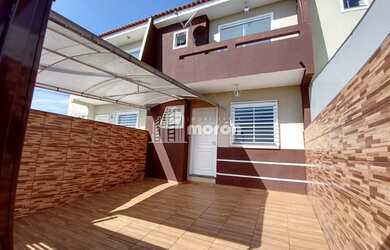 Imagem: A casa possui 2 Dormitórios, 1 Banheiro, 2 Vagas na garagem