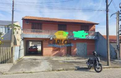 Imagem: A casa possui 5 Dormitórios, 4 Banheiros, 3 Vagas na garagem