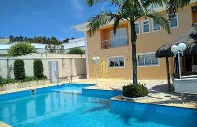 Imagem: A casa em condomínio possui 5 Dormitórios, 5 Banheiros, 5