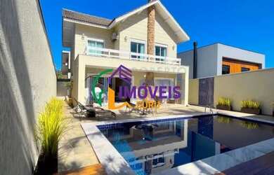 Imagem: A casa em condomínio possui 4 Dormitórios, 5 Banheiros, 4