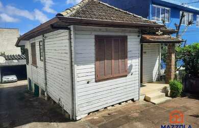 Imagem: A casa possui 3 Dormitórios, 1 Banheiro, 5 Vagas na garagem