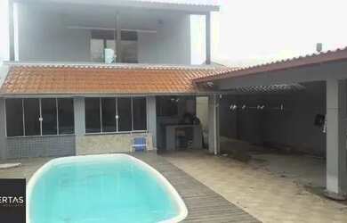 Imagem: A casa possui 3 Dormitórios, 4 Banheiros, 4 Vagas na garagem