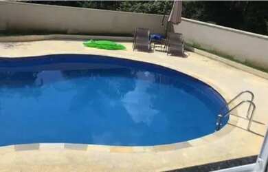 Imagem: A casa em condomínio possui 4 Dormitórios, 5 Banheiros, 4