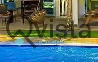 Imagem: A casa possui 4 Dormitórios, 5 Banheiros, 4 Vagas na garagem