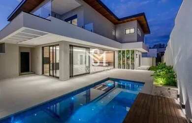 Imagem: A casa possui 5 Dormitórios, 5 Banheiros, 5 Vagas na garagem