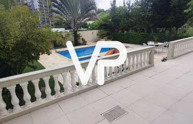 Imagem: A casa possui 4 Dormitórios, 5 Banheiros, 5 Vagas na garagem