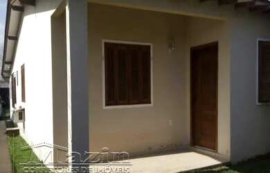 Imagem: A casa possui 3 Dormitórios, 2 Banheiros, 3 Vagas na garagem