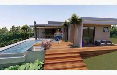 Imagem: A casa possui 4 Dormitórios, 3 Banheiros, 4 Vagas na garagem