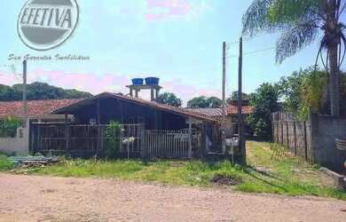 Imagem: A casa possui 4 Dormitórios, 3 Banheiros, 4 Vagas na garagem