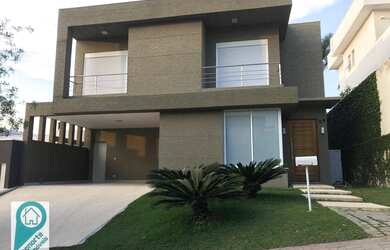 Imagem: A casa em condomínio possui 4 Dormitórios, 5 Banheiros, 4