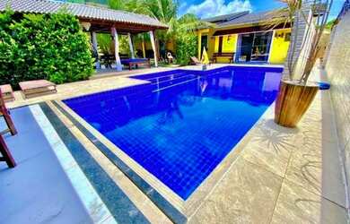 Imagem: A casa possui 5 Dormitórios, 5 Banheiros, 5 Vagas na garagem