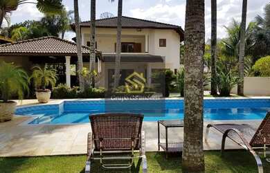 Imagem: A casa possui 5 Dormitórios, 5 Banheiros, 5 Vagas na garagem