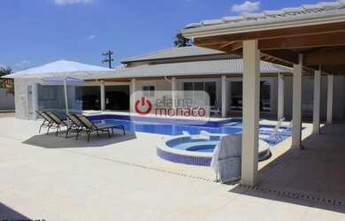 Imagem: A casa em condomínio possui 4 Dormitórios, 5 Banheiros, 5