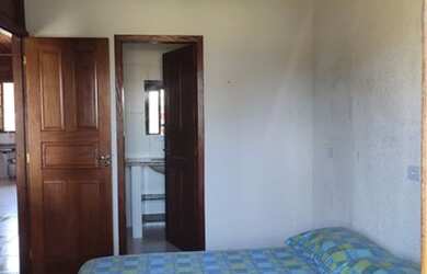 Imagem: A casa possui 2 Dormitórios, 2 Vagas na garagem, Churrasqueira