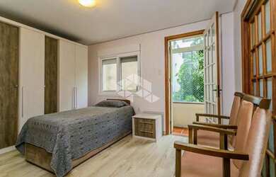 Imagem 10: Apartamento de 113m2, living em 3 ambientes cercado por jardim de inverno