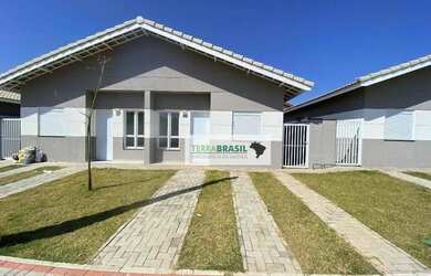 Imagem: A casa em condomínio possui 2 Dormitórios, 1 Banheiro, 2 Vagas