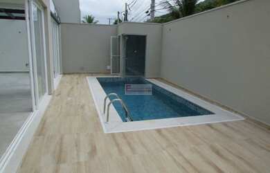 Imagem: A casa em condomínio possui 4 Dormitórios, 4 Banheiros, 4