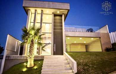 Imagem: A casa possui 4 Dormitórios, 5 Banheiros, 5 Vagas na garagem