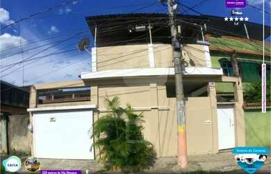 Imagem: A casa possui 3 Dormitórios, 2 Banheiros, 3 Vagas na garagem