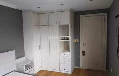 Imagem 12: Apartamento com 1 dormitório, lareira e sacada em bairro arborizado