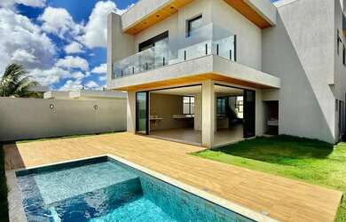 Imagem: A casa possui 3 Dormitórios, 5 Banheiros, 4 Vagas na garagem