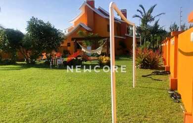 Imagem: A casa possui 5 Dormitórios, 4 Banheiros, 2 Vagas na garagem